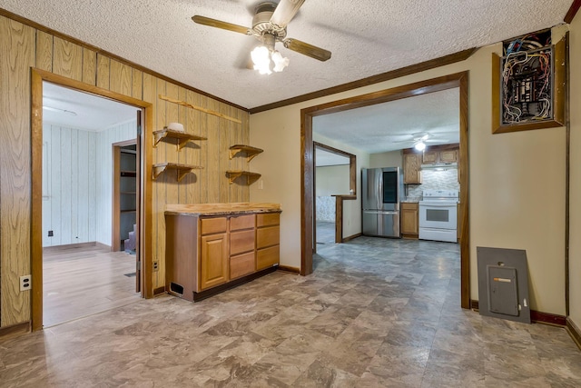 159 Clover St, Granville, TN 38564 - kitchen with smart refrigerator, electric range, a ceiling fan, wooden walls, and crown molding
