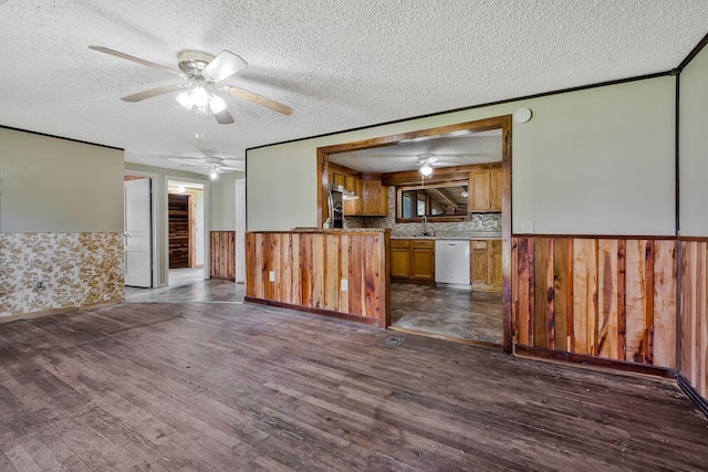 159 Clover St, Granville, TN 38564 - kitchen with dishwasher, ceiling fan, wainscoting, brown cabinetry, and dark wood-style flooring