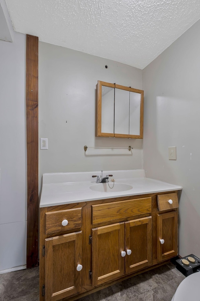 159 Clover St, Granville, TN 38564 - bathroom with vanity and a textured ceiling