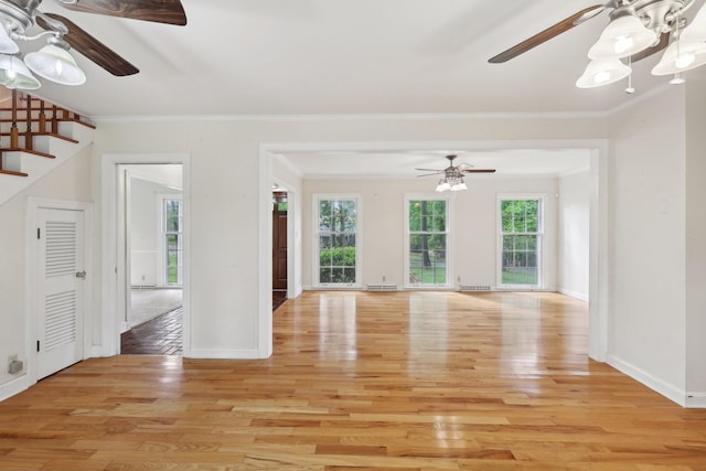 111 Lois Ln, Clarksville, TN 37043 - unfurnished living room with light wood-type flooring, stairs, ornamental molding, baseboards, and a ceiling fan