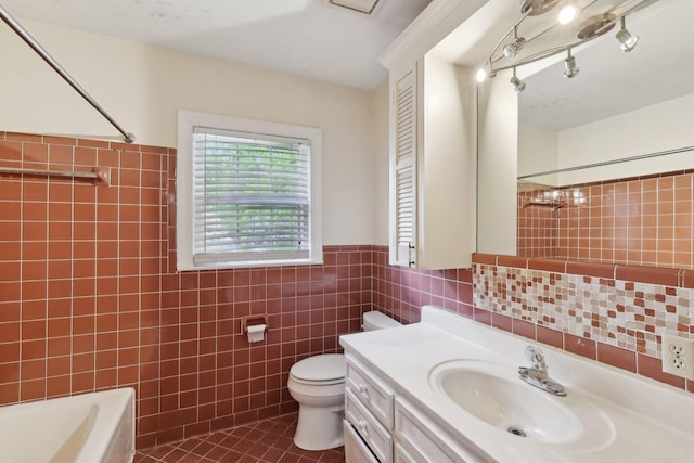 111 Lois Ln, Clarksville, TN 37043 - bathroom featuring tile walls, toilet, tile patterned flooring, vanity, and a wainscoted wall
