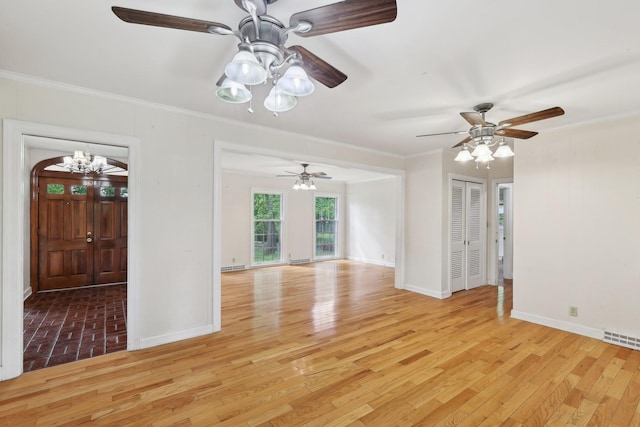 111 Lois Ln, Clarksville, TN 37043 - unfurnished room with baseboards, a chandelier, crown molding, and light wood-style flooring