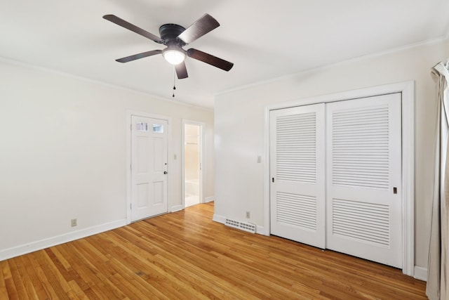 111 Lois Ln, Clarksville, TN 37043 - unfurnished bedroom with crown molding, baseboards, light wood-style floors, a closet, and ceiling fan