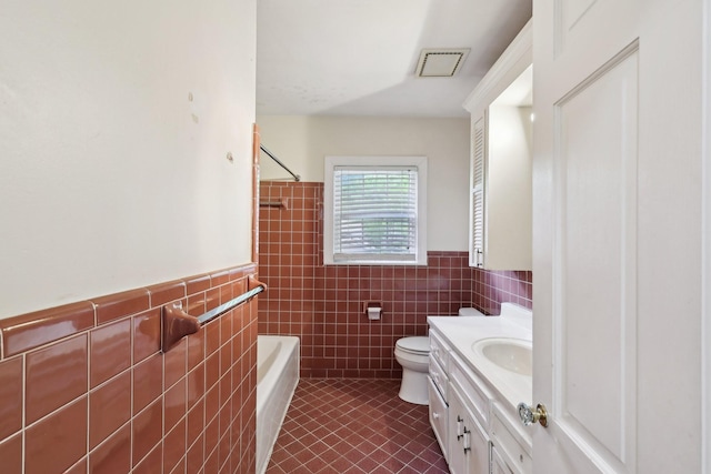 111 Lois Ln, Clarksville, TN 37043 - full bath with tile walls, tile patterned floors, vanity, toilet, and shower / bathtub combination