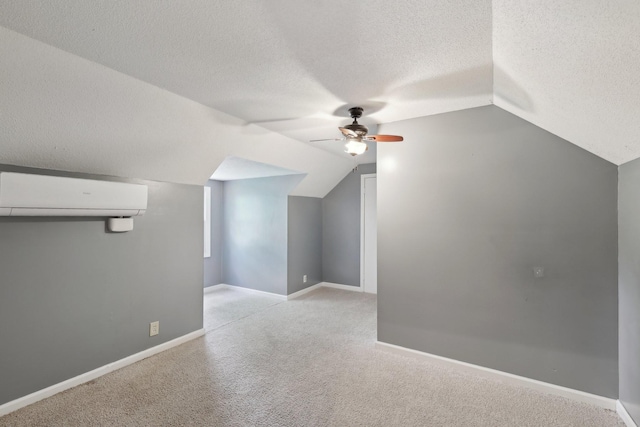 111 Lois Ln, Clarksville, TN 37043 - additional living space with a wall unit AC, ceiling fan, a textured ceiling, vaulted ceiling, and carpet floors