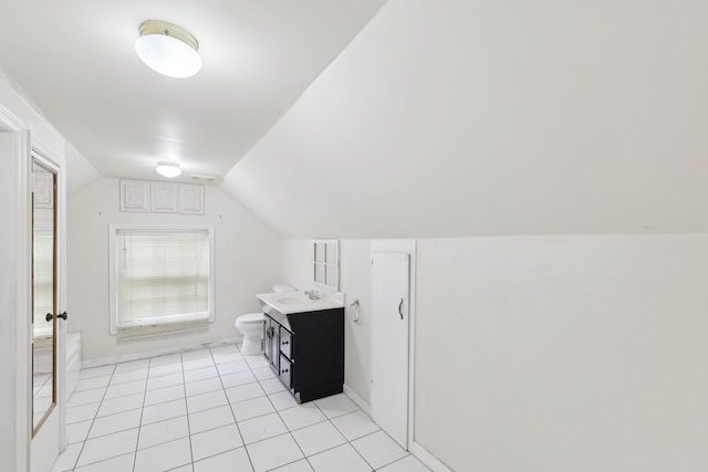 111 Lois Ln, Clarksville, TN 37043 - bathroom with vaulted ceiling, vanity, tile patterned flooring, toilet, and baseboards