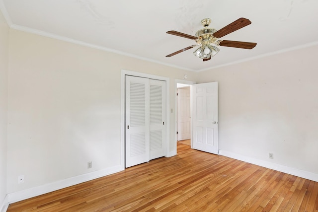 111 Lois Ln, Clarksville, TN 37043 - unfurnished bedroom featuring light wood-style flooring, baseboards, a closet, crown molding, and ceiling fan