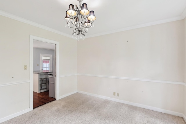 111 Lois Ln, Clarksville, TN 37043 - unfurnished room featuring carpet, a chandelier, crown molding, and baseboards
