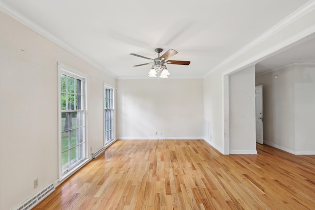 111 Lois Ln, Clarksville, TN 37043 - spare room featuring ornamental molding, a ceiling fan, light wood-style flooring, a baseboard heating unit, and baseboards
