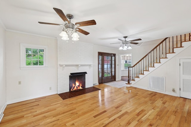 111 Lois Ln, Clarksville, TN 37043 - unfurnished living room with healthy amount of natural light, wood finished floors, and stairway