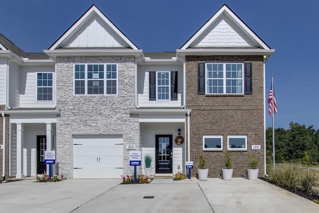 204 Hazel Ln, Lebanon, TN 37087 - view of property with driveway, a garage, stone siding, and brick siding