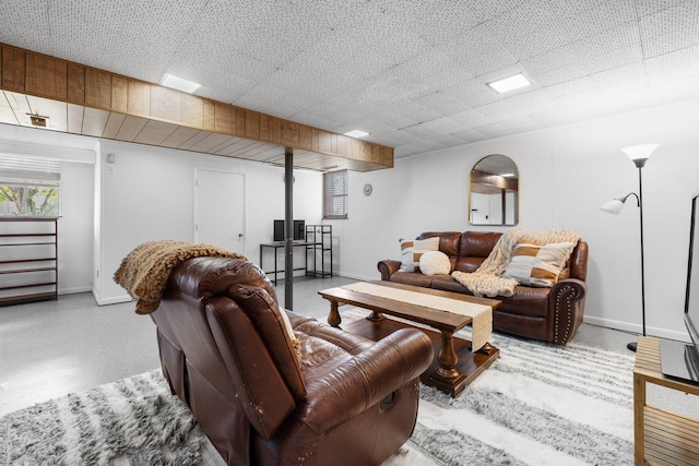living area featuring baseboards