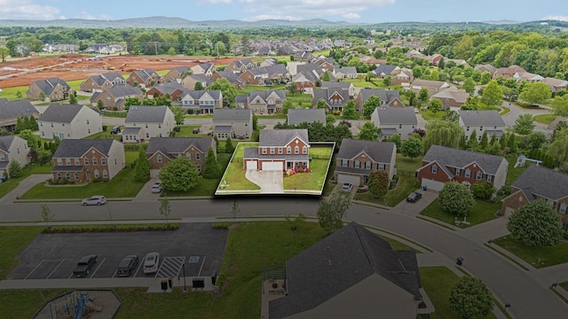 aerial view of residential area with a mountainous background