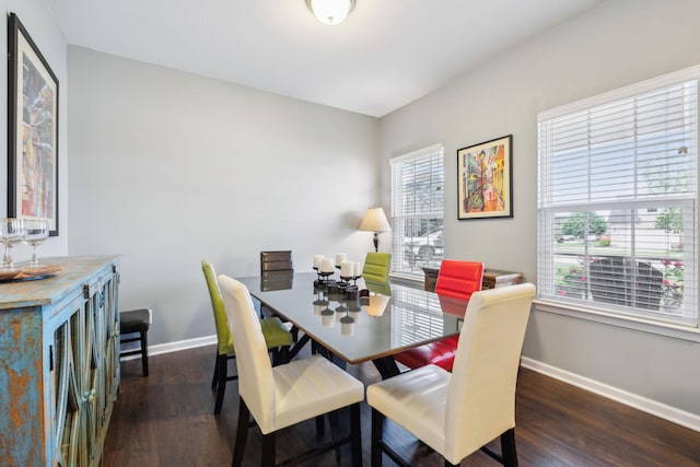 dining area featuring baseboards and wood finished floors