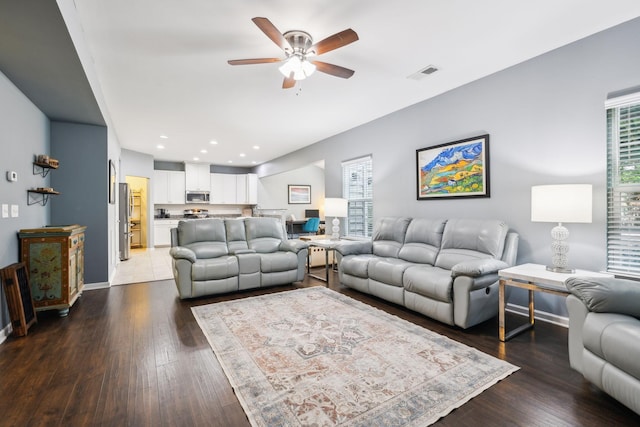 living room with a ceiling fan, hardwood / wood-style floors, baseboards, and recessed lighting