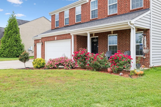 view of front facade with a front lawn, an attached garage, driveway, and brick siding