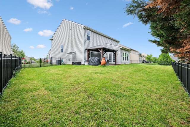 rear view of property featuring a gazebo