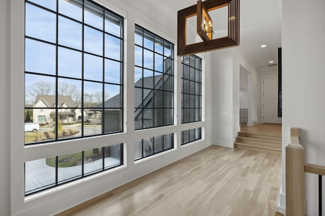 entrance foyer with light wood-style floors, baseboards, and recessed lighting
