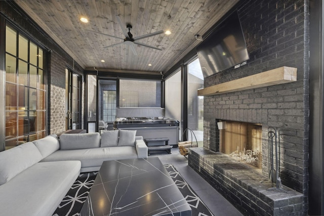 living area featuring a ceiling fan, recessed lighting, wooden ceiling, and a brick fireplace