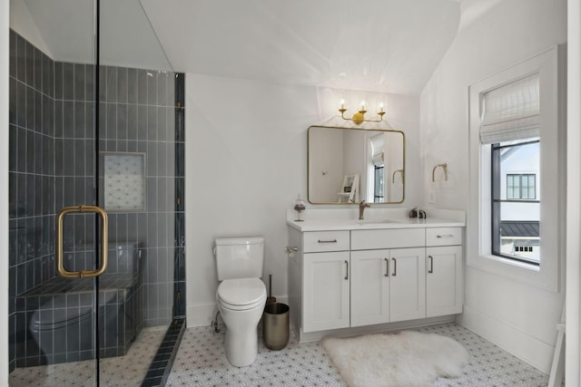 bathroom featuring a chandelier, toilet, a shower stall, vanity, and baseboards