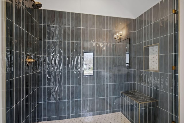 full bath featuring a tile shower