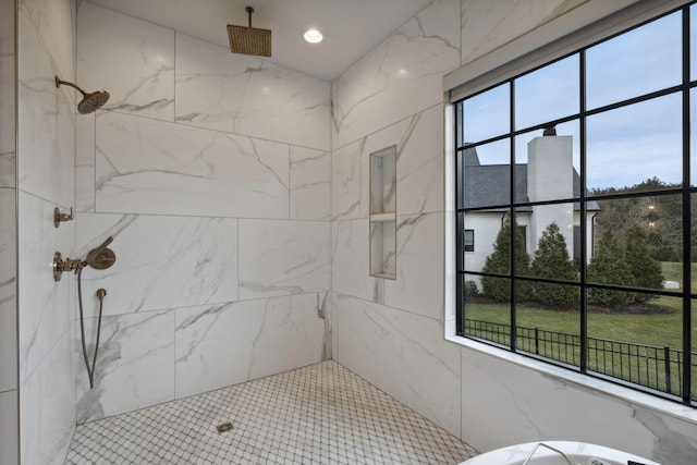 bathroom with a marble finish shower