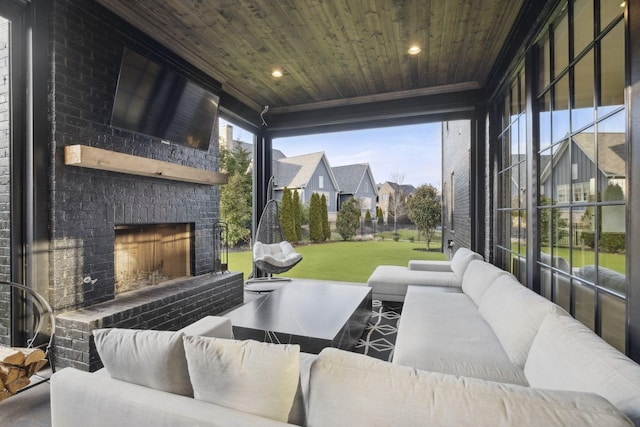 view of patio / terrace with an outdoor living space with a fireplace