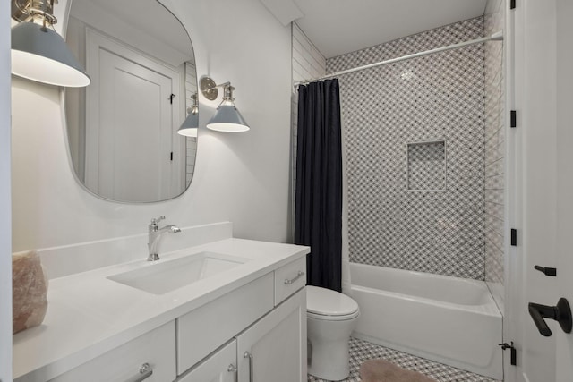 bathroom featuring tile patterned floors, toilet, vanity, and shower / bath combo