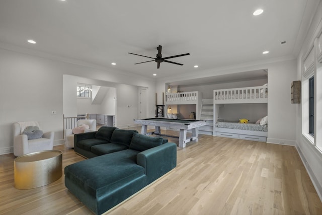 living room featuring wood finished floors, recessed lighting, crown molding, baseboards, and a ceiling fan
