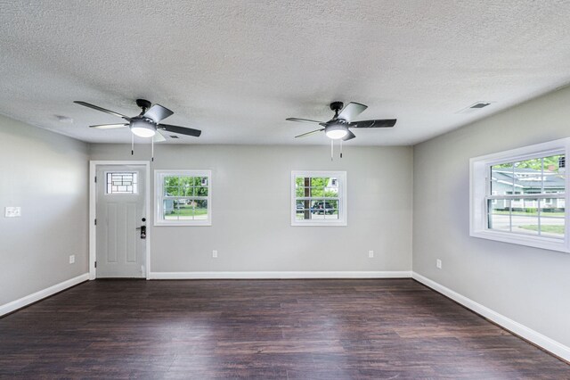 204 Wilson Ave, Auburn, KY 42206 - empty room featuring ceiling fan, healthy amount of natural light, wood finished floors, baseboards, and a textured ceiling