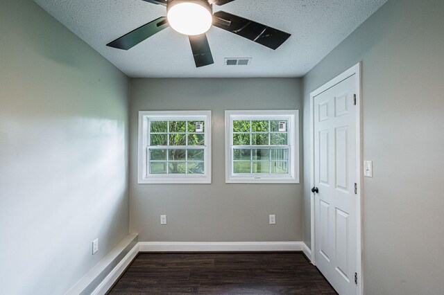 204 Wilson Ave, Auburn, KY 42206 - empty room featuring dark wood-style flooring, a ceiling fan, a textured ceiling, and baseboards