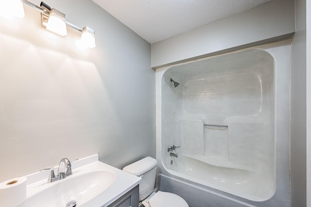 204 Wilson Ave, Auburn, KY 42206 - full bathroom with toilet, vanity, bathing tub / shower combination, and a textured ceiling