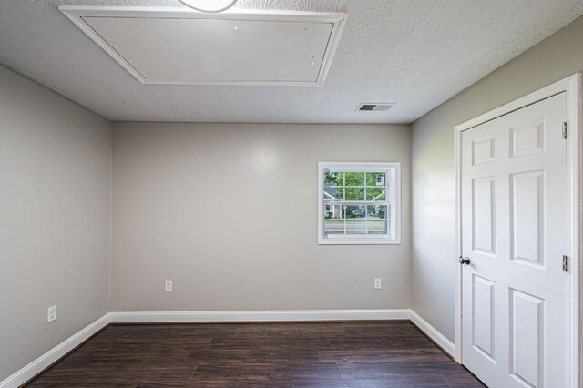 204 Wilson Ave, Auburn, KY 42206 - unfurnished room featuring attic access, dark wood finished floors, and baseboards