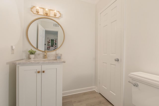1002 E Northfield Blvd # A102, Murfreesboro, TN 37130 - bathroom with wood finished floors, vanity, toilet, and baseboards