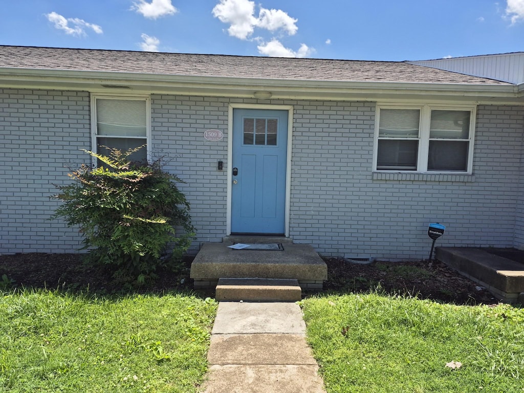 1509B 21st Ave N, Nashville, TN 37208 - property entrance with brick siding and roof with shingles