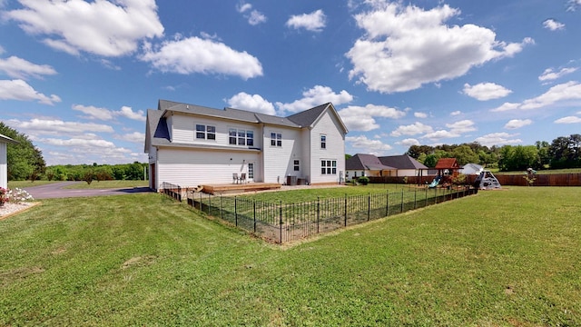 548 Buddy Rd, Burns, TN 37029 - rear view of house with a playground and driveway