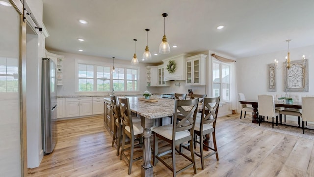 548 Buddy Rd, Burns, TN 37029 - dining room featuring light wood-style floors, recessed lighting, and a chandelier