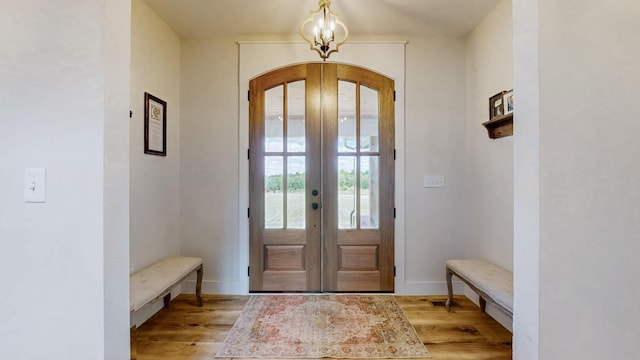 548 Buddy Rd, Burns, TN 37029 - doorway to outside with arched walkways, french doors, and light wood-style floors