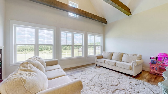 548 Buddy Rd, Burns, TN 37029 - living area featuring wood finished floors, high vaulted ceiling, baseboards, and beamed ceiling