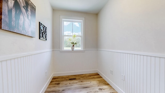 548 Buddy Rd, Burns, TN 37029 - empty room with wood finished floors and wainscoting