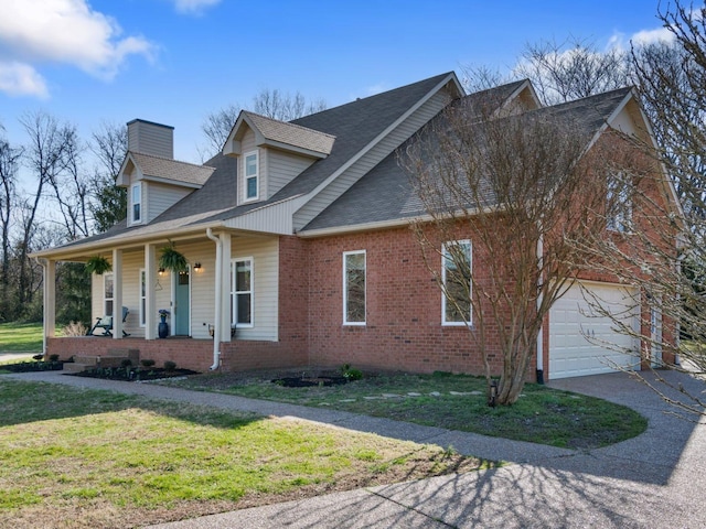 view of front facade with covered porch, a chimney, concrete driveway, a front lawn, and roof with shingles
