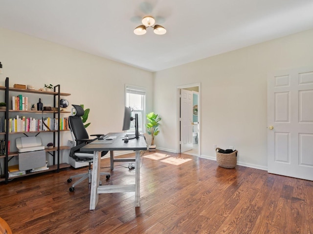 office area with wood finished floors and baseboards