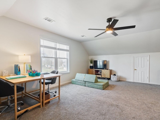 office space with vaulted ceiling, carpet flooring, ceiling fan, and baseboards