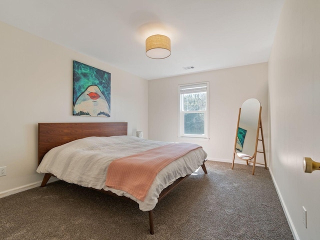 carpeted bedroom featuring baseboards