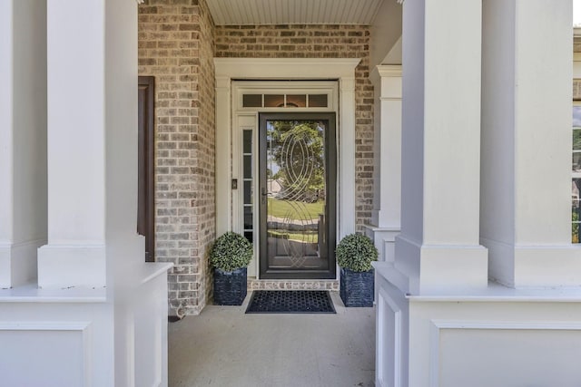 property entrance with brick siding