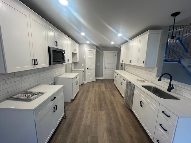 614 Woodrush Dr, Clarksville, TN 37040 - kitchen with appliances with stainless steel finishes, a sink, tasteful backsplash, recessed lighting, and dark wood finished floors