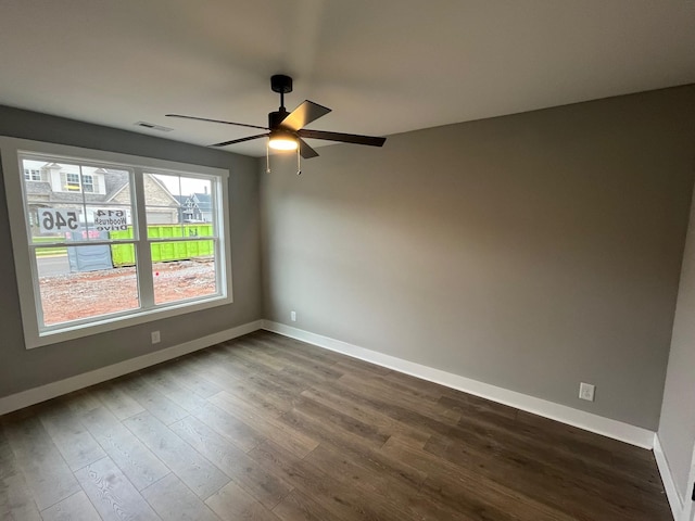614 Woodrush Dr, Clarksville, TN 37040 - spare room featuring a ceiling fan, baseboards, and dark wood-style flooring