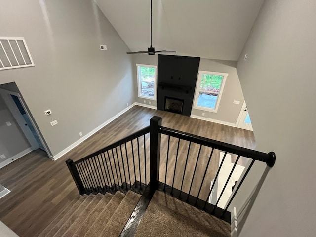 614 Woodrush Dr, Clarksville, TN 37040 - stairs with wood finished floors, a ceiling fan, baseboards, a fireplace, and high vaulted ceiling