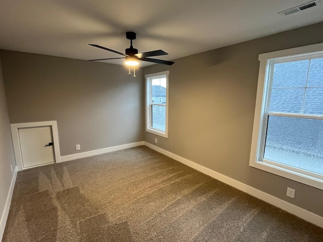 614 Woodrush Dr, Clarksville, TN 37040 - empty room with a ceiling fan, baseboards, and dark colored carpet