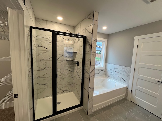 614 Woodrush Dr, Clarksville, TN 37040 - bathroom featuring a marble finish shower, a garden tub, marble finish flooring, and recessed lighting